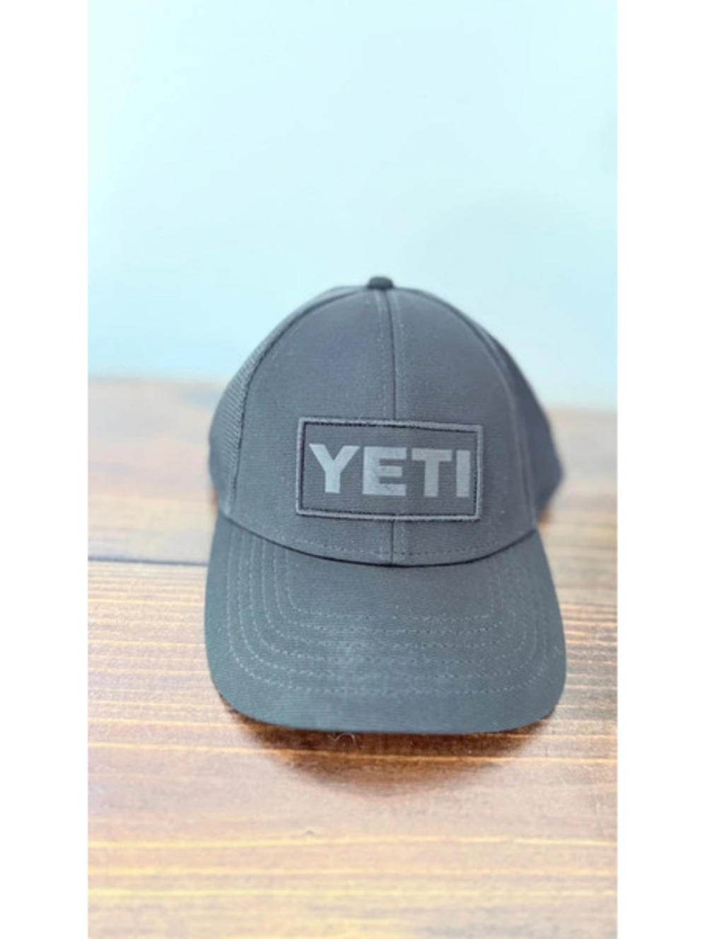 Yeti Core Patch Trucker Hat is a black mesh-backed cap